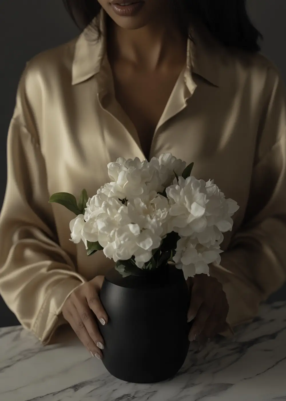 white flowers in black vase